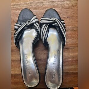 Black high heels with strapy silver knot front.